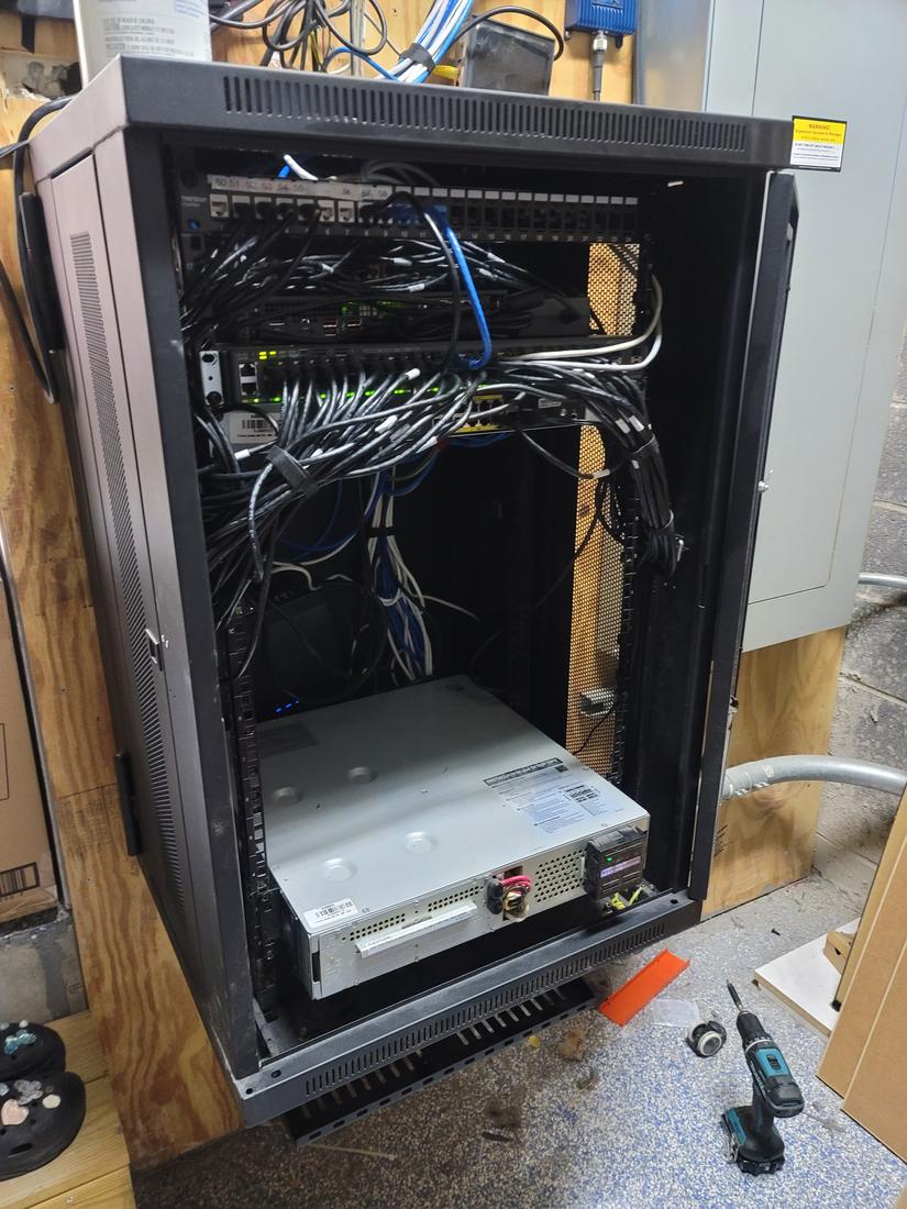 After: Wall cabinet: cables re-routed and equipment properly mounted
