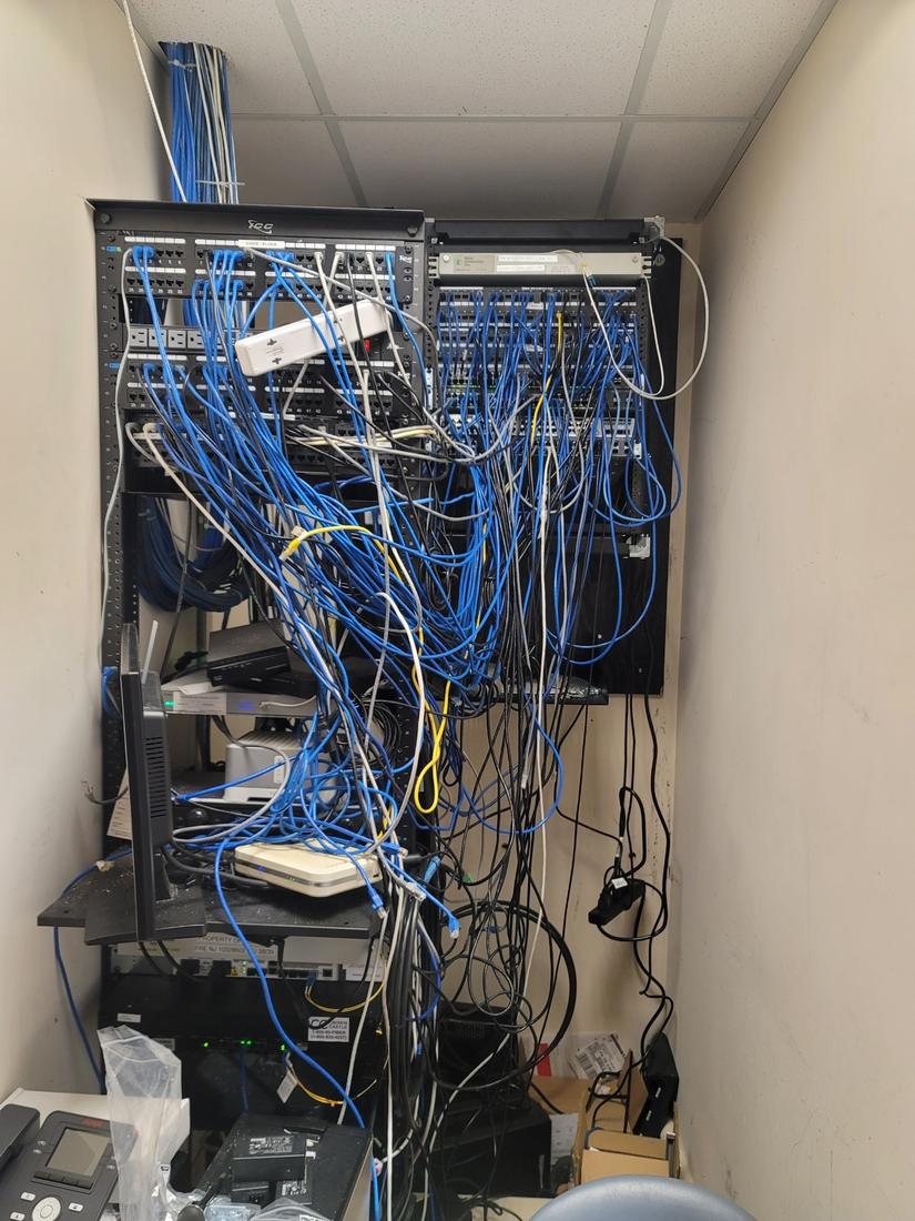 Before: Office network closet: re-patched, labeled, and cleaned up