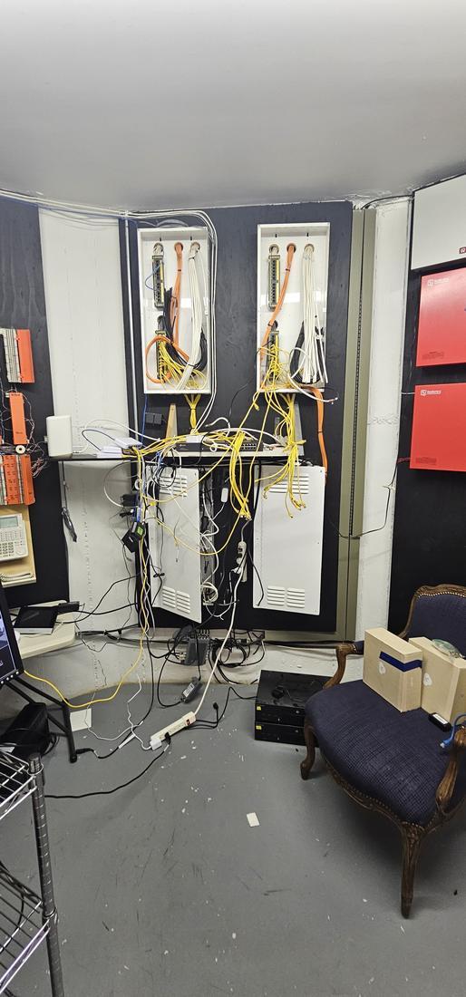 Before: Low-voltage room: new enclosures with cable runs bundled and closed up
